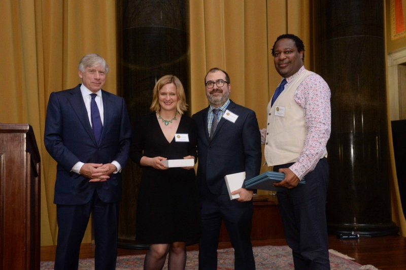 Robert Moore of the Daily News in New York (right), with Sarah Ryley, formerly of the News, and Eric Umansky of ProPublica, accepts the 2017 Pulitzer Prize for Public Service from Columbia University President Lee C. Bollinger (left). The award was for uncovering, primarily through Ryley’s work, widespread abuse of eviction rules by the police to oust hundreds of people, most of them poor people of color. The News and ProPublica jointly published the story. (pulitzer.org)